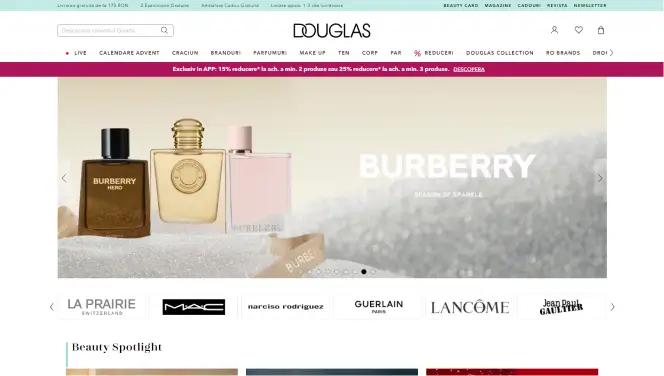  Screenshot der Douglas-Website, zeigt Burberry-Parfüm mit dem Text 'Burberry - Season of Sparkle'. Verschiedene Markenlogos wie La Prairie, MAC, Guerlain, und Lancôme sind ebenfalls sichtbar. 